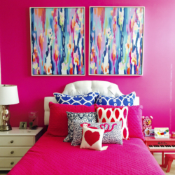 bright pink girls bedroom with custom artwork