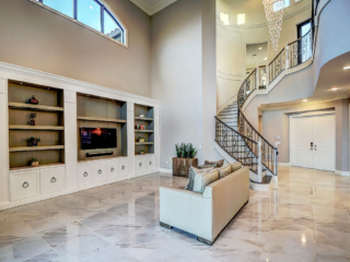 builder home living space with custom cabinetry