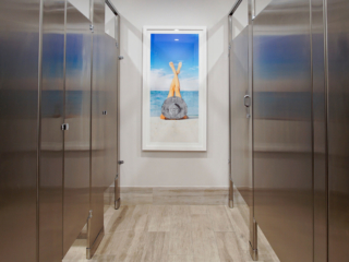 commercial bathroom with artwork