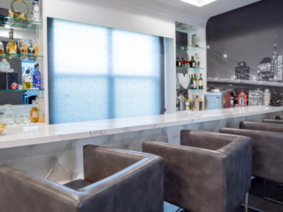 custom bar cabinetry with cityscape wallpaper