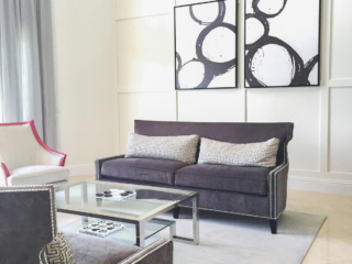 custom wall trim and artwork pop out in this living room