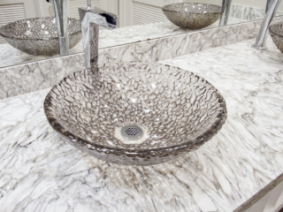 glass bowl sink with marble countertop