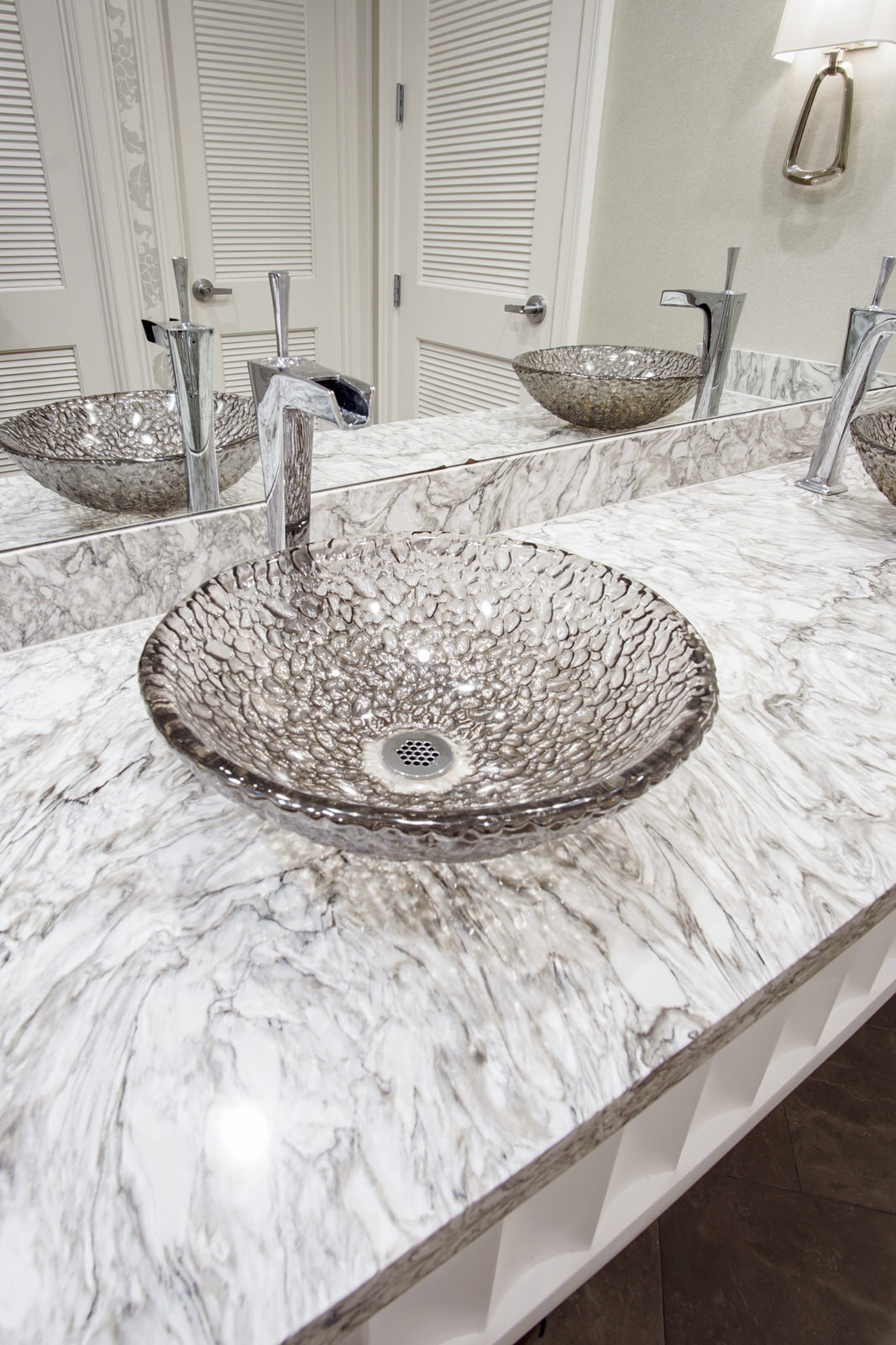 glass bowl sink with marble countertop