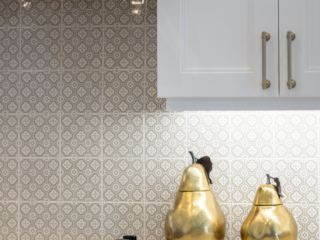 gold pear accent in white kitchen