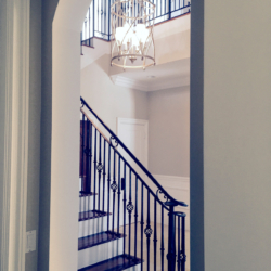 high end foyer with statement lighting fixture