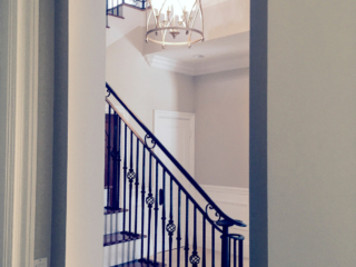 high end foyer with statement lighting fixture