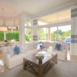 large windows in white and light blue living space