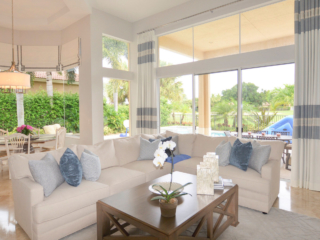 large windows in white and light blue living space