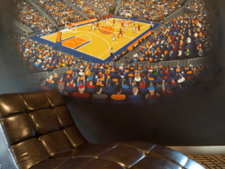 lounge chair with custom painting on wall game room