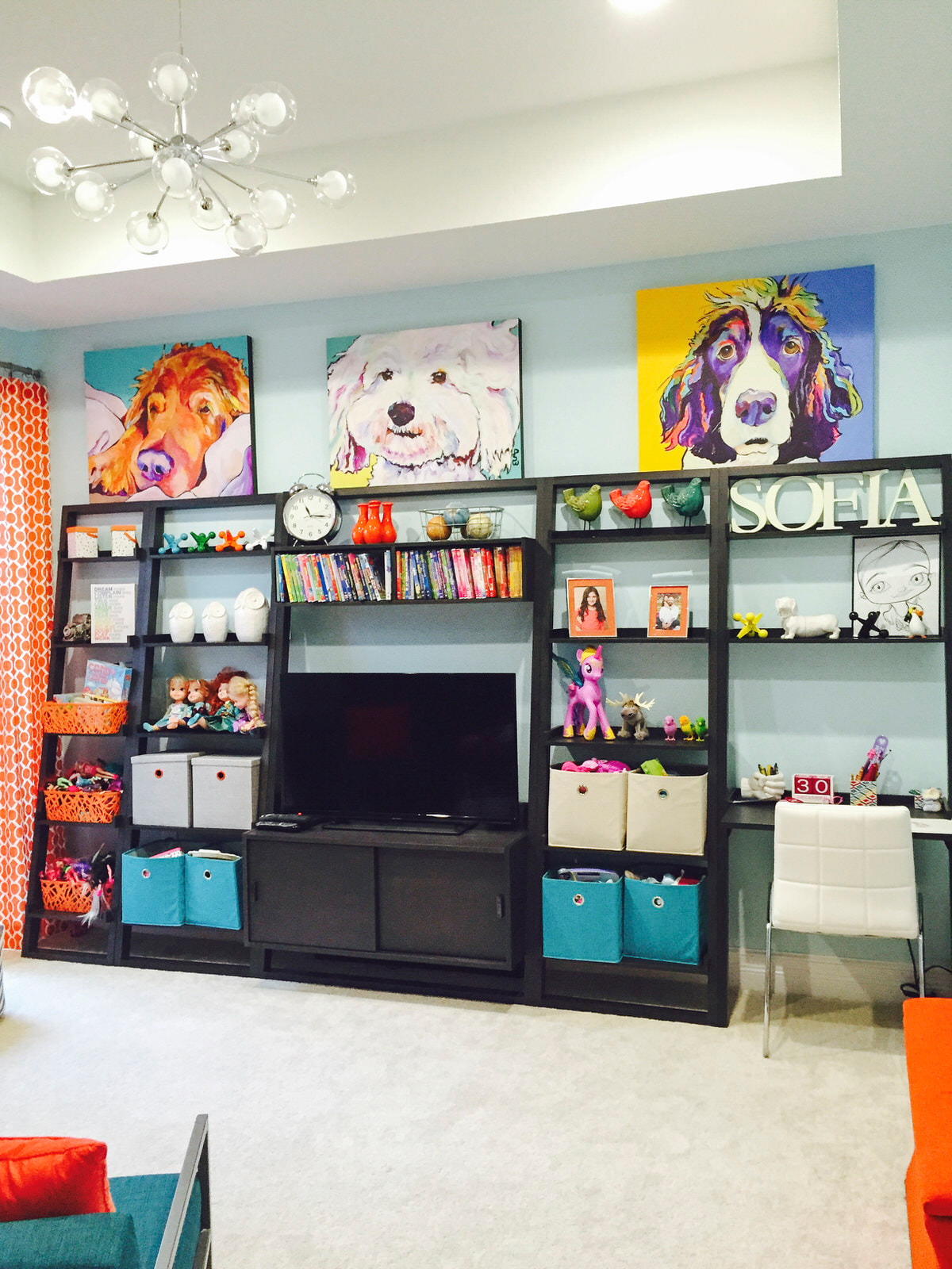 orange and teal kids space with wall unit