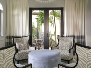 patterned chairs and blue ottoman