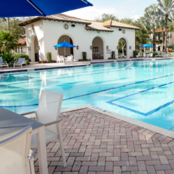 poolside table and chairs with umbrella commercial