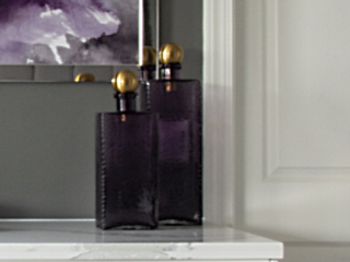 purple bottles with gold stoppers