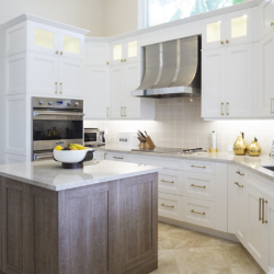 white cabinetry with wood island kitchen