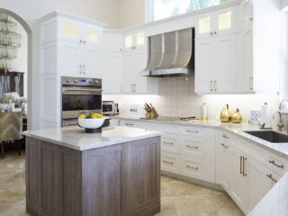white cabinetry with wood island kitchen
