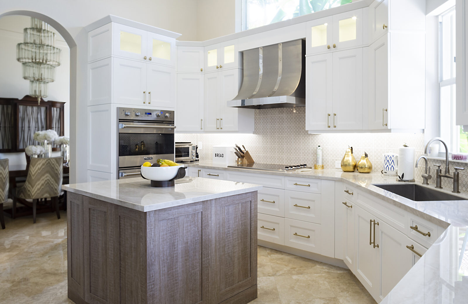 white cabinetry with wood island kitchen